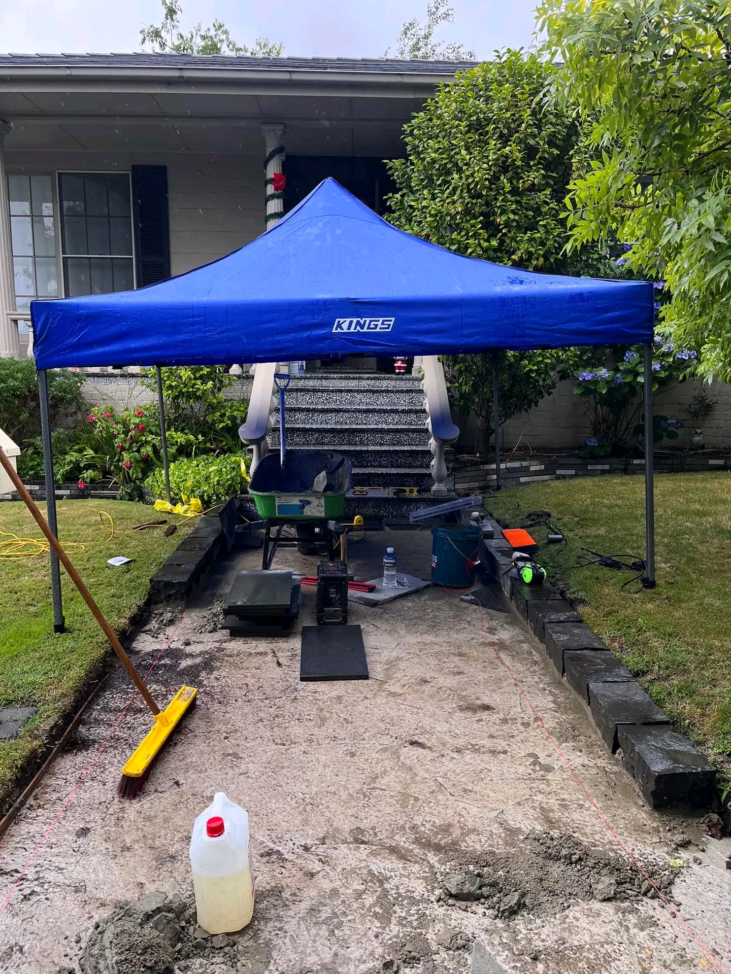 Canterbury plate compacting under a temporary pergola
