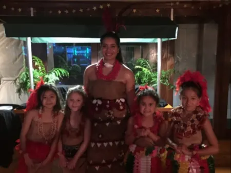 Rachel and her cousins before her Tau'olunga at an 80th celebration 