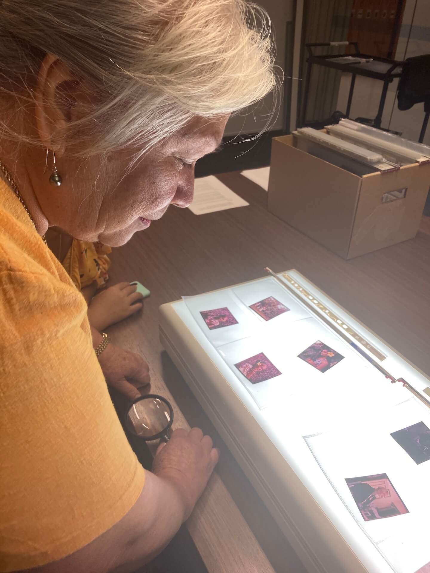 Woman looking at slides on a table