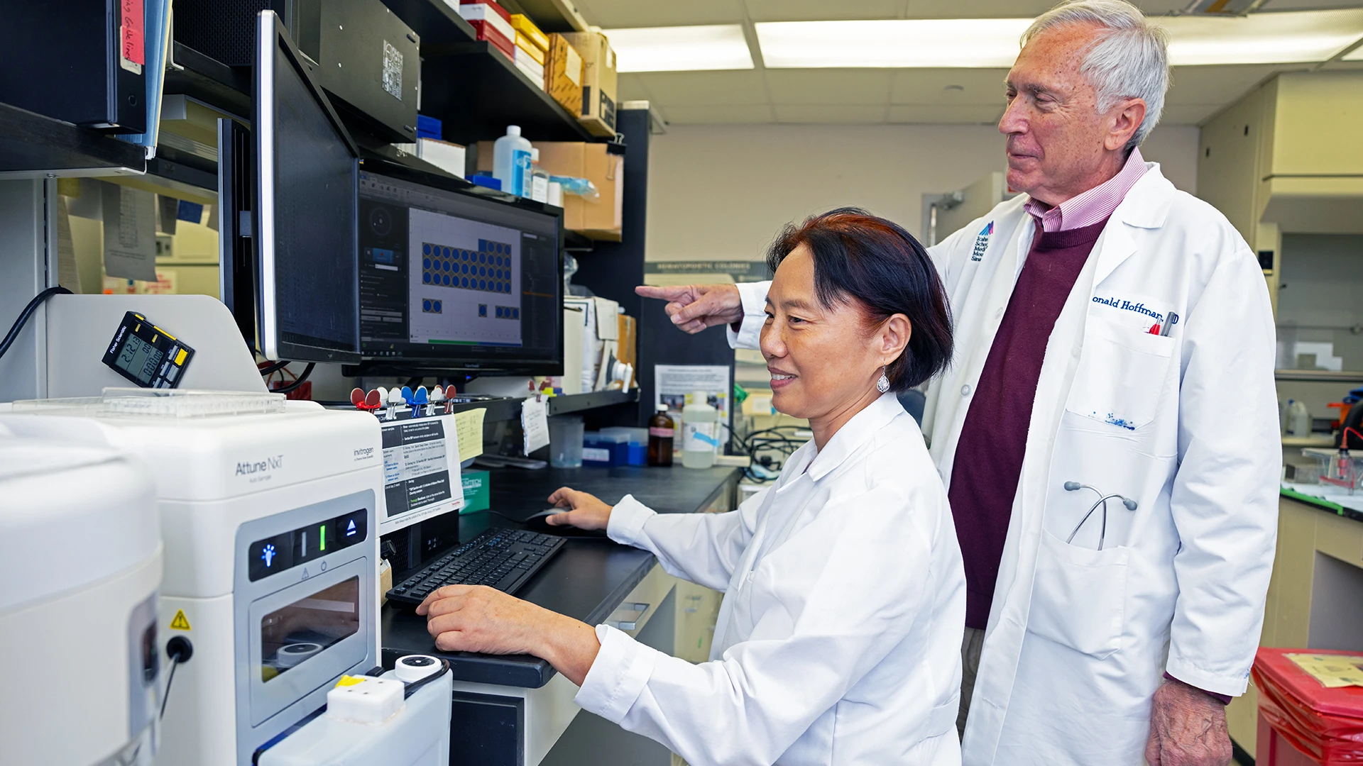 Cell line work in myeloproliferative neoplasms and disorders frequently feature flow cyclometry, seen here as Ronald Hoffman, MD (right) discusses scatter findings with Min Lu, MD, PhD (left). A current line of research involves targeting malignant hematopoietic stem cells in acute myeloid leukemia.
