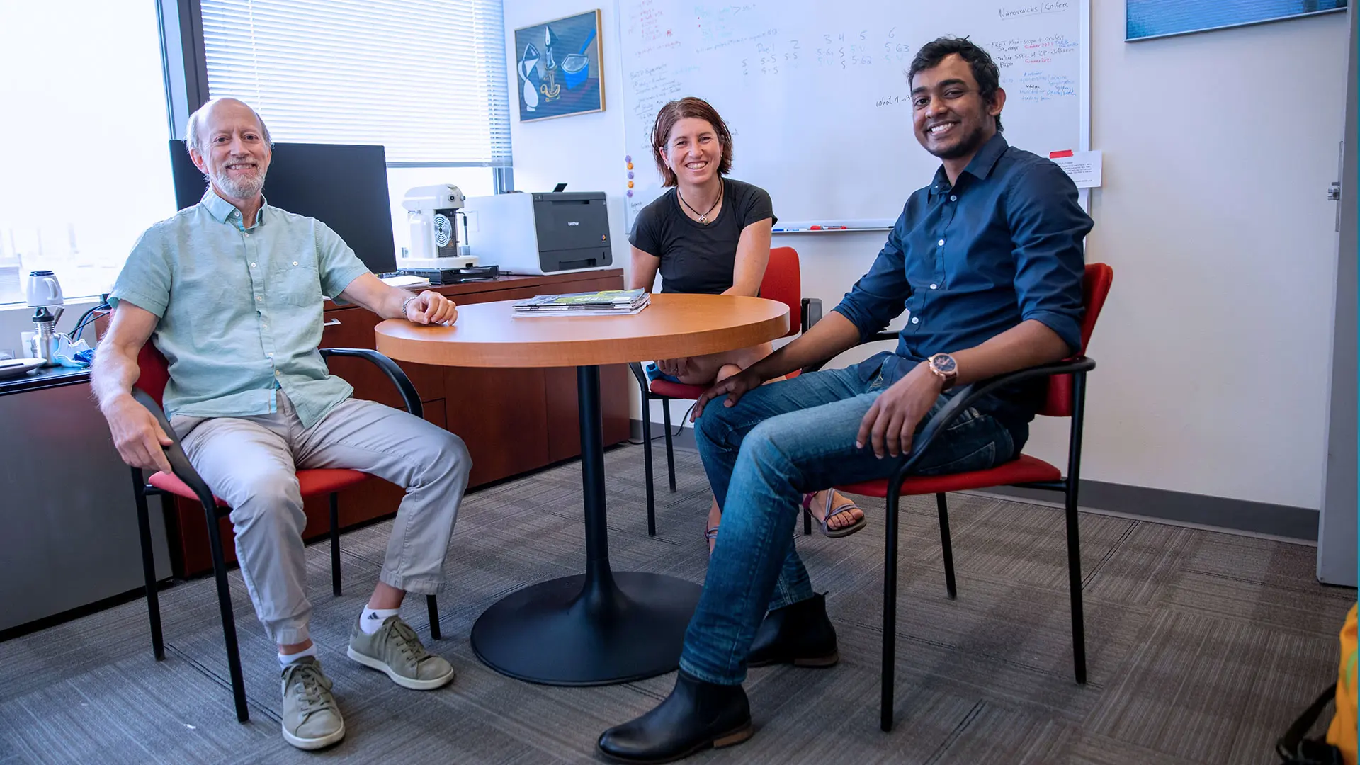 Michael B. Fernando, fourth-year PhD Neuroscience student, right, with thesis advisors Paul Slesinger, PhD, and Kristen Brennand, PhD 