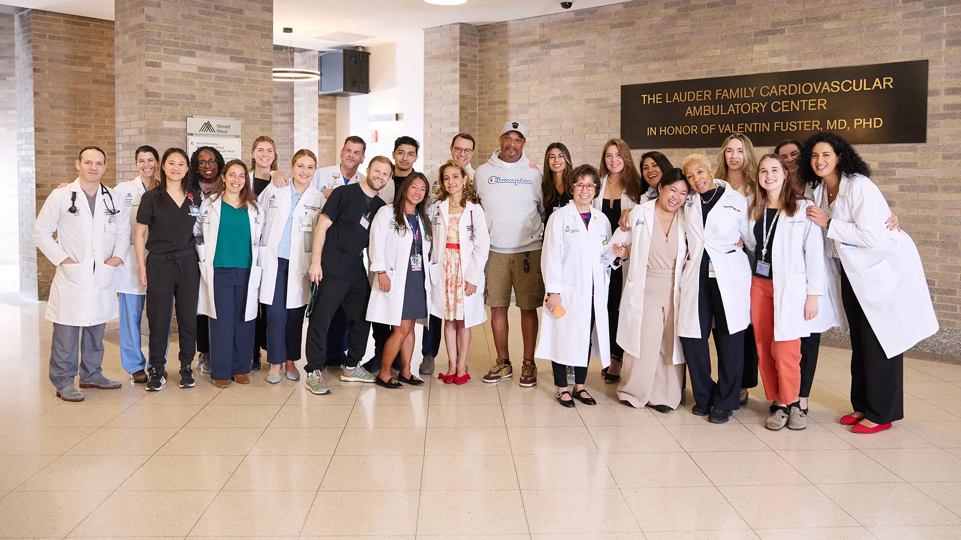 Triple transplant patient Mack Godbee, center, with members of the liver and heart teams who cared for him and joined him after he returned for a follow-up visit to The Mount Sinai Hospital. By his side is Noah Moss, MD, an advanced heart failure and transplant cardiologist, who has cared for Mr. Godbee for nearly a decade.