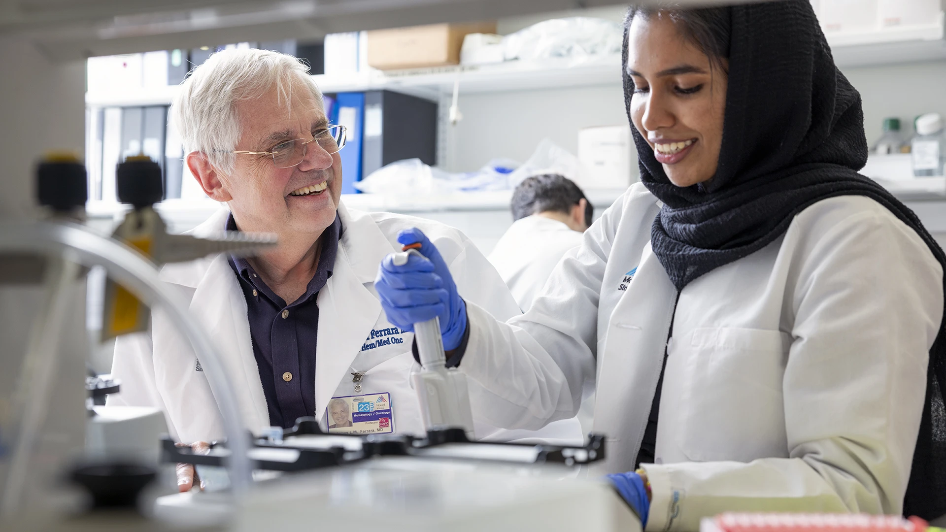 James Ferrara, MD (left), and research associate Rahnuma Beheshti (right) analyzing biomarkers that measure gastrointestinal tissue damage from a blood sample of a patient participating in a Mount Sinai sponsored clinical trial.