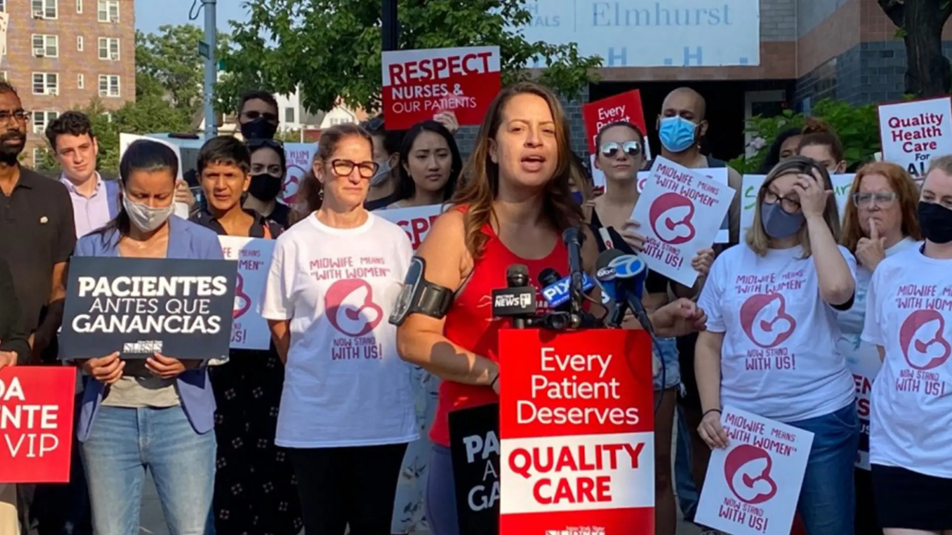 Department of Medicine faculty and students, including Duncan Maru,  MD, PhD, left rear next to lamppost, participated in a demonstration on behalf of pay parity for midwives, a key racial, immigrant, and gender justice issue. Speaking was New York State Assemblywoman Catalina Cruz.