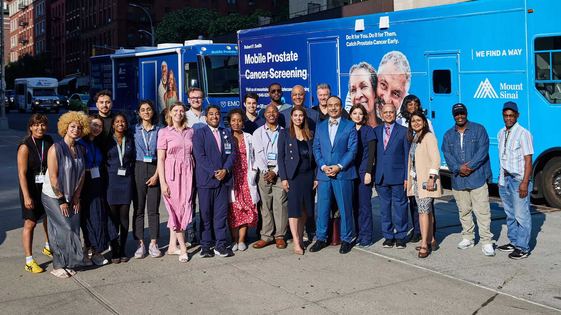 The team from the Mount Sinai Department of Urology stands beside the Mount Sinai Robert F. Smith Mobile Prostate Cancer Screening Unit parked outside of The Mount Sinai Hospital beside the mobile unit that would be launched by the Winship Cancer Institute of Emory University in Atlanta. 
