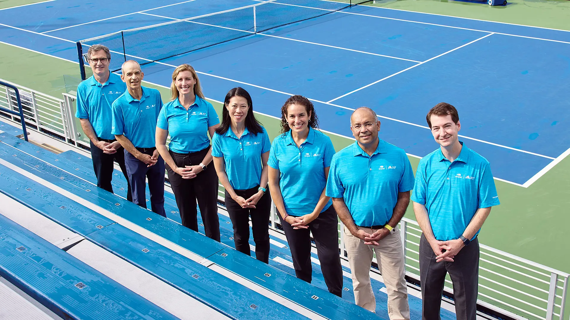 Dr. Colvin, center, stands with her team of Mount Sinai orthopedists at the 2023 US Open in Queens, New York.