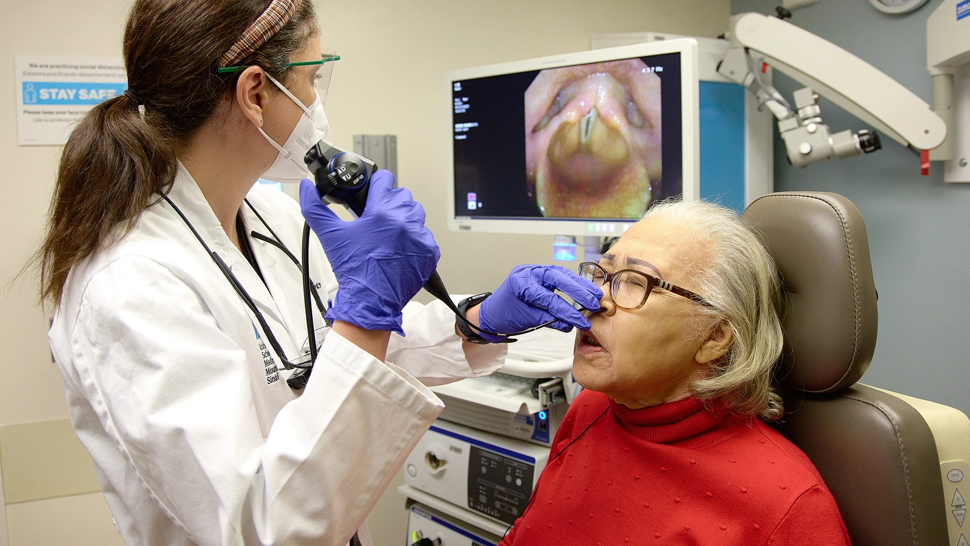 Dr. Kirke assesses the vocal cords of a patient presenting with voice change.