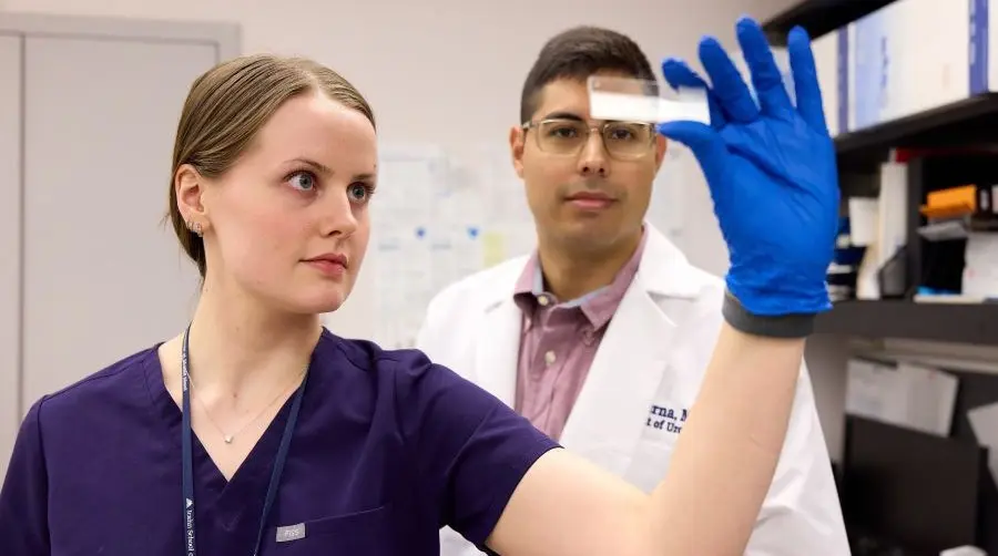 In the research lab are Campbell Vogt , left, a third-year medical student at the Icahn School of Medicine at Mount Sinai, and Juan Serna, MD, Endourology Fellow-AUA Research Scholar