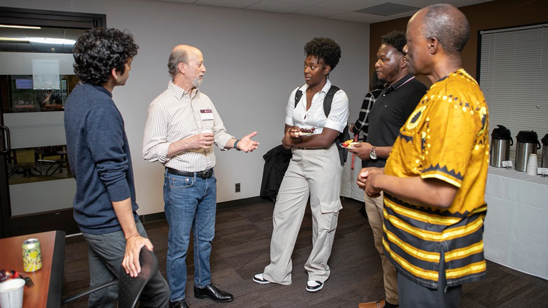 Mount Sinai’s Paul A. Slesinger, PhD, second from left, meets with PhD students from Meharry Medical College and Sanika S. Chirwa, MD, PhD, right. 