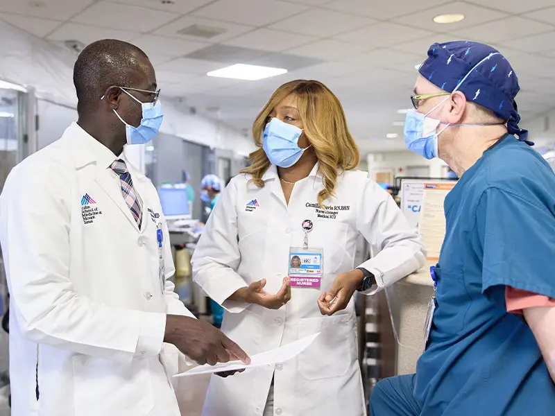 Samuel Acquah, MD; Camille Davis, BSN, RN; and Eddie Valentin, BSN, RN, on the medical intensive care unit at The Mount Sinai Hospital