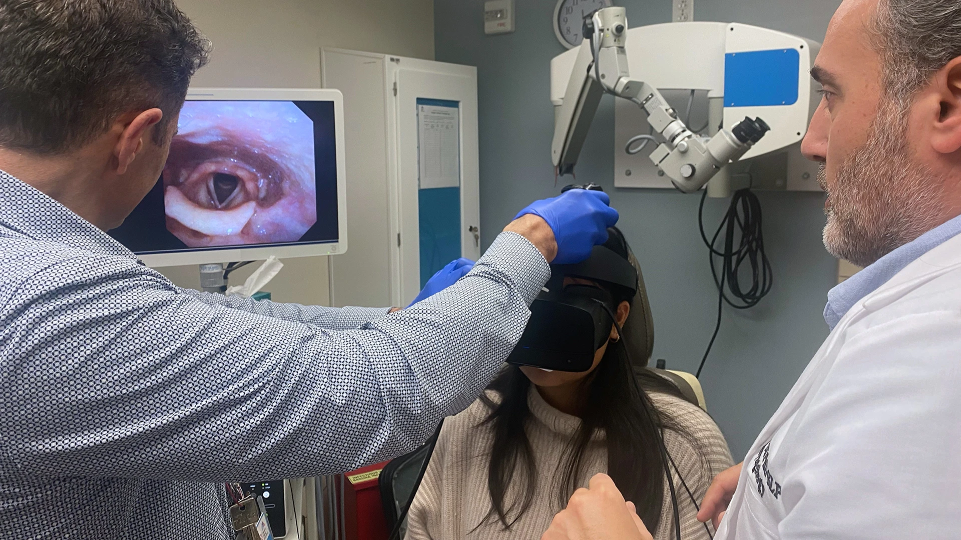 Drs. Daşdöğen (right) and Courey conduct an endoscopic examination to visualize vocal folds while assessing a patient in a VR scenario.