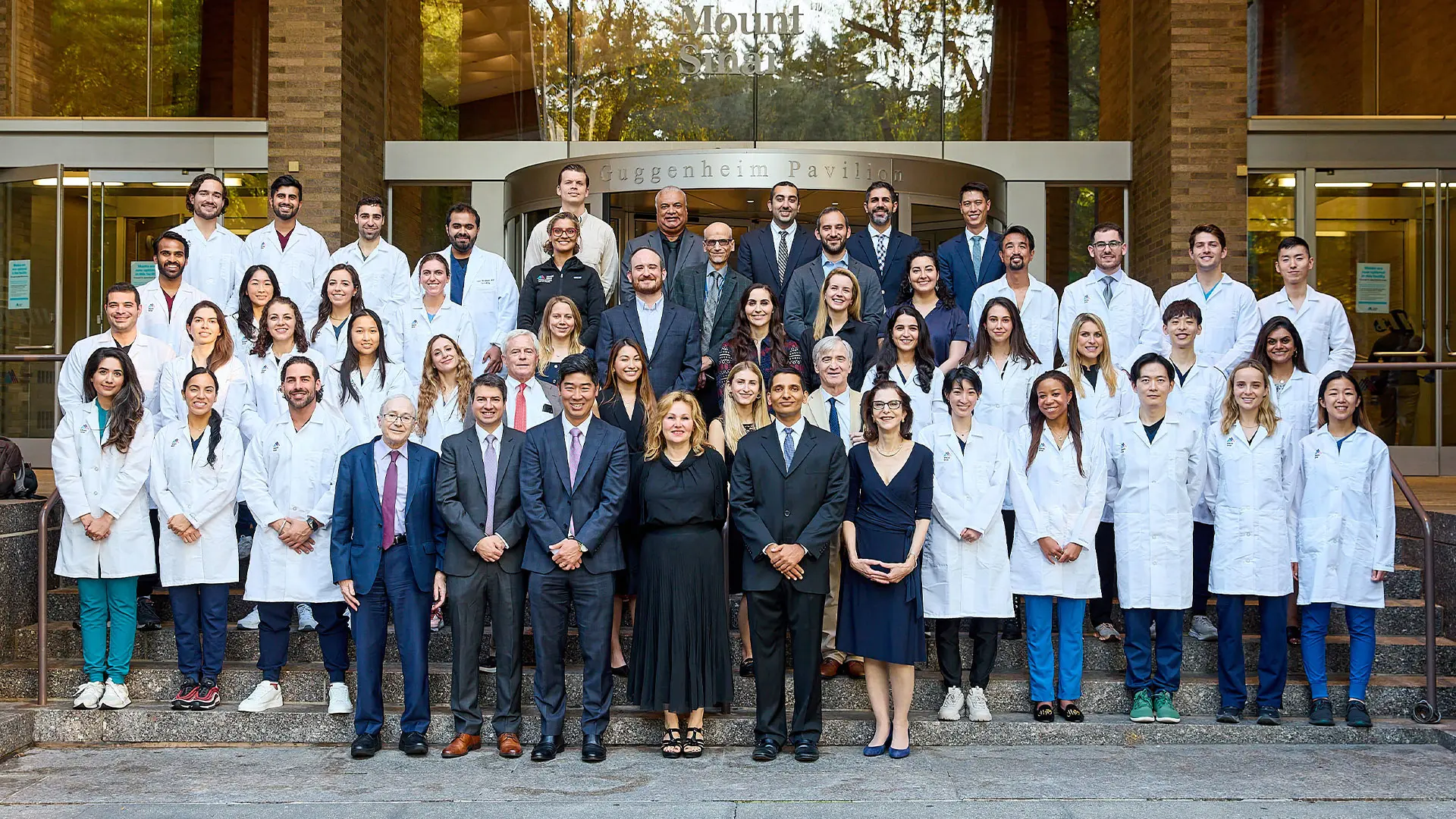 Emma Guttman, MD, PhD, center, with faculty, residents, and fellows of the Kimberly and Eric J. Waldman Department of Dermatology