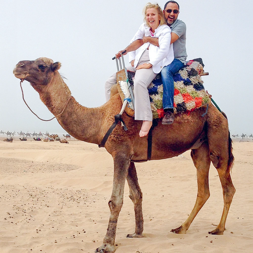 Beyond returning to work, Ms. Lieberman had taken on the challenge of traveling the world, where in this photo, she is seen with her husband, Mark, riding a camel in Morocco, on October 2014.