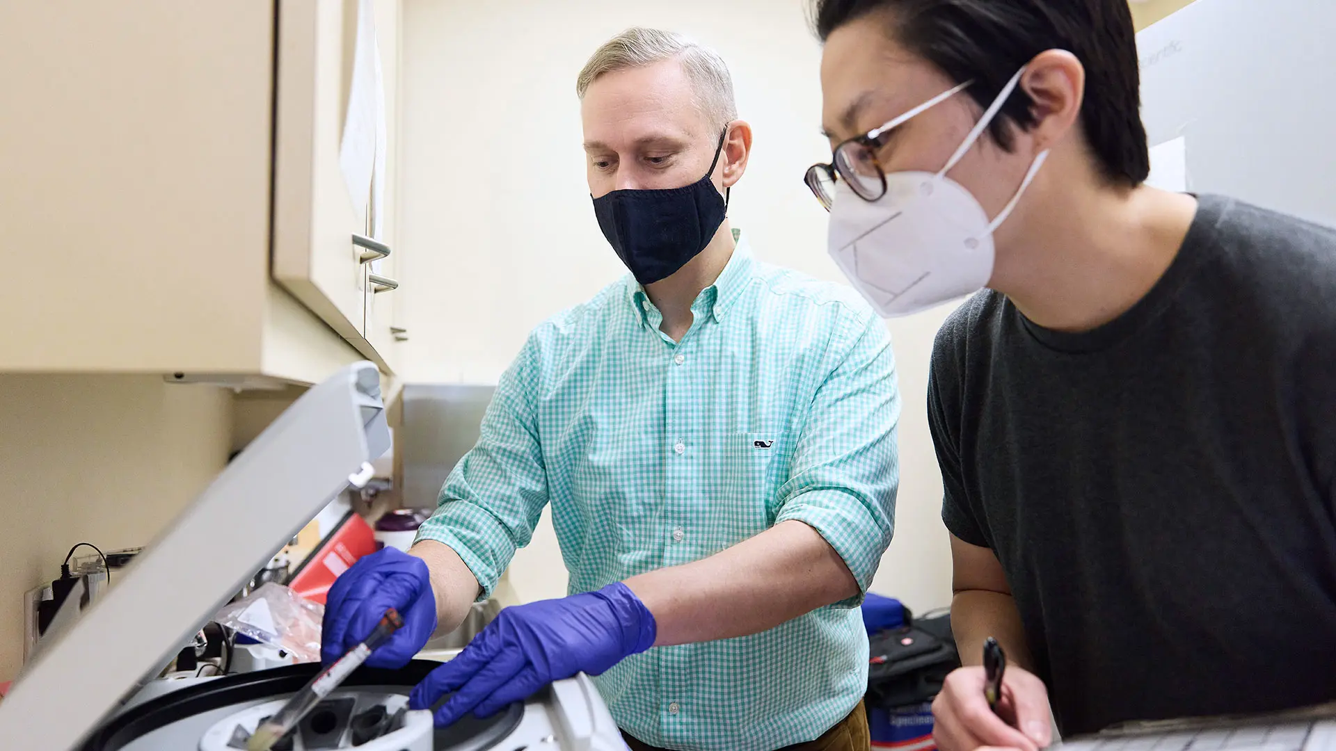 Andrew Varga, MD, PhD, and Korey Kam, PhD, use a centrifuge to process plasma for Alzheimer's disease biomarkers in sleep apnea patients who use continuous positive airway pressure therapy.  