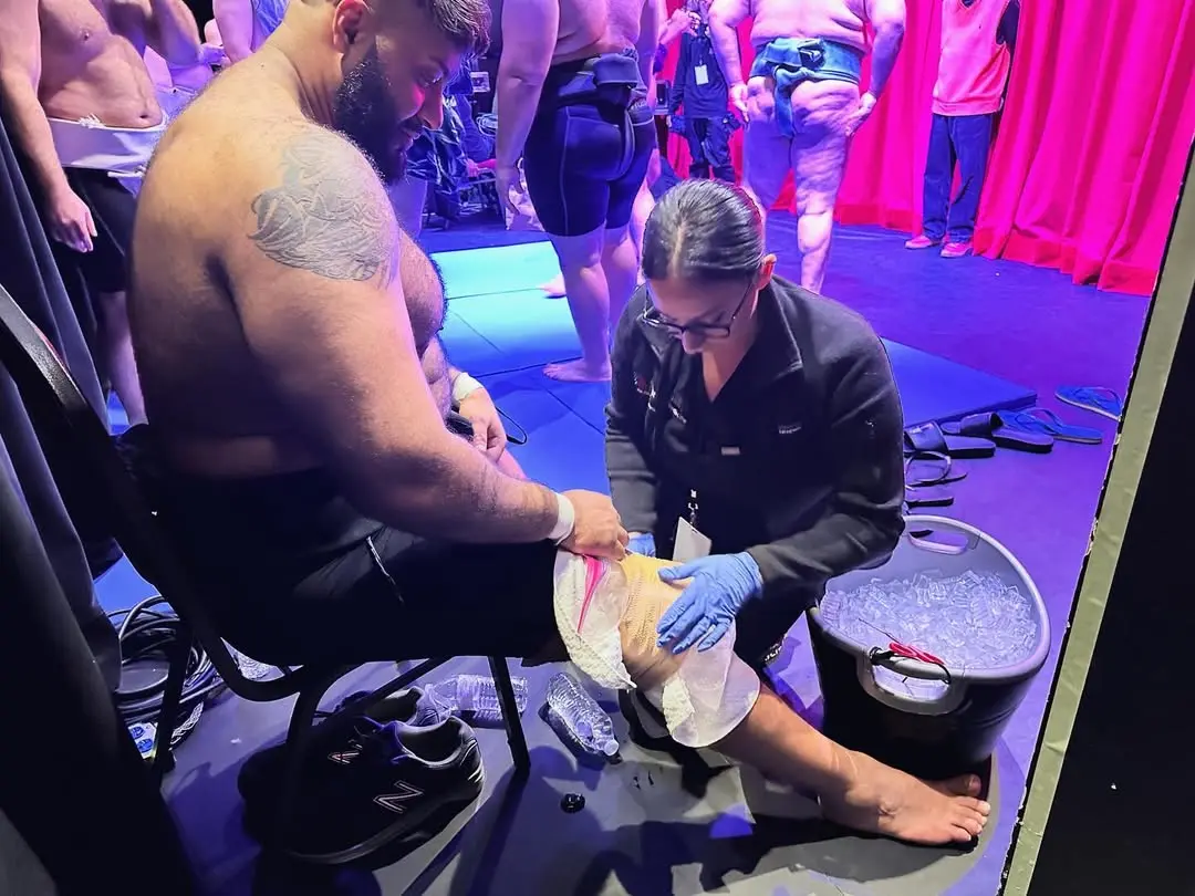 Treating athletes on-site at a competition can be tricky as all manners of injuries can occur, notes Dr. Zakhary, pictured treating an athlete at an International Sumo League match. For trainees to gain such hands-on experience at a fellowship program is fairly uncommon, she adds.