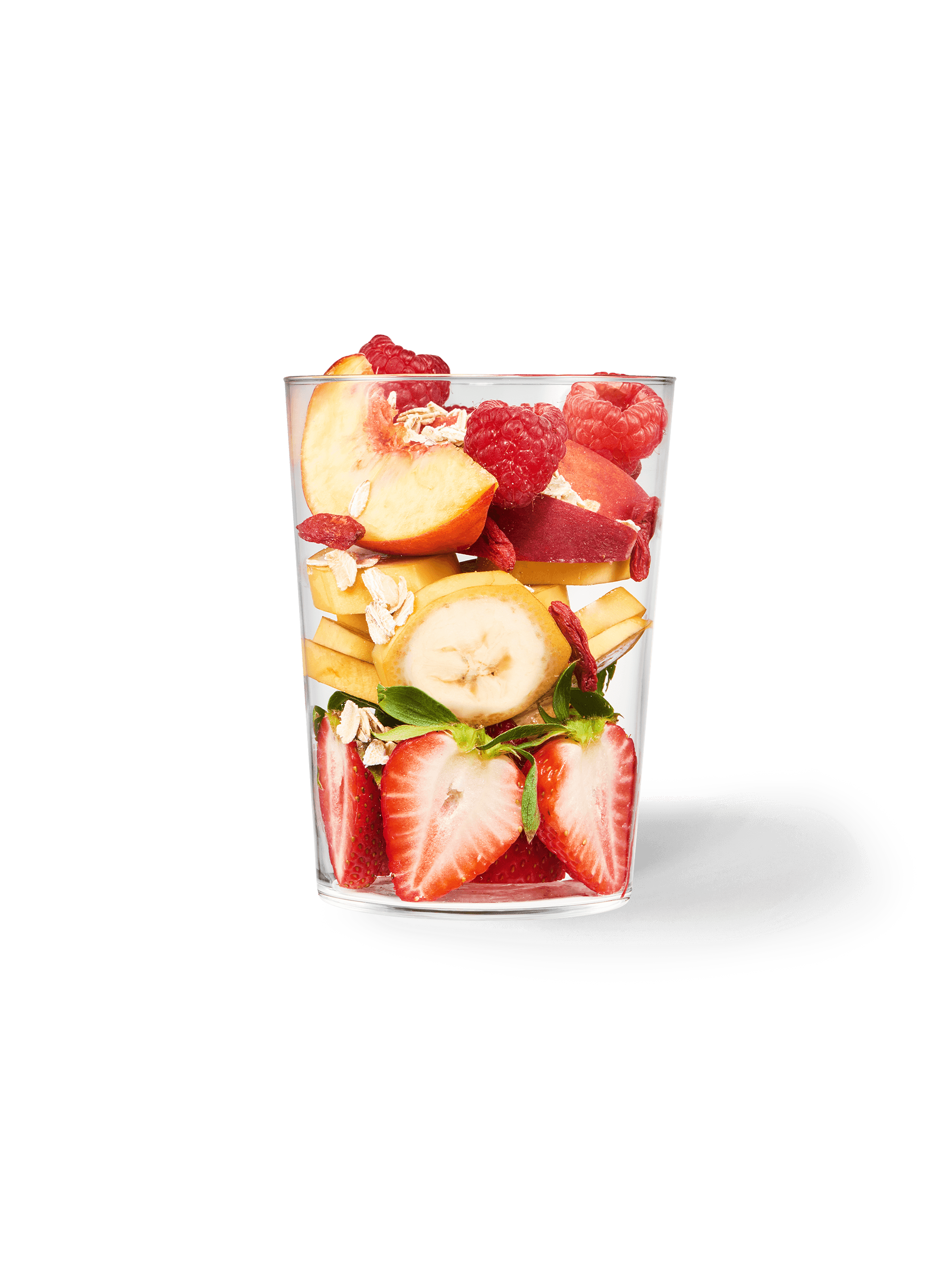 A clear cup filled with the ingredients included in our Strawberry + Peach Smoothie