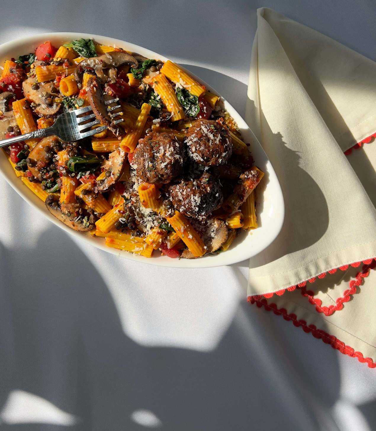 Tomato Basil + Portobello Bolognese prepared with meatballs