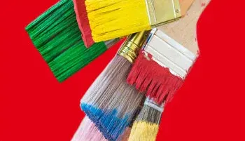 paintbrushes on a red background