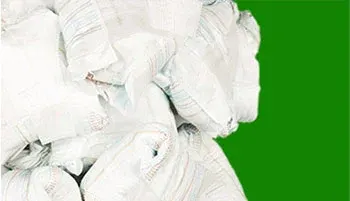 disposable diapers on a green background