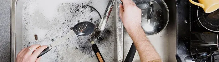 dishes being washed in a sink