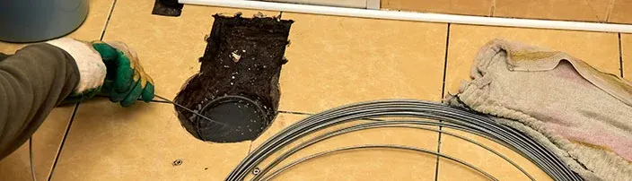 drain snake in bathroom floor