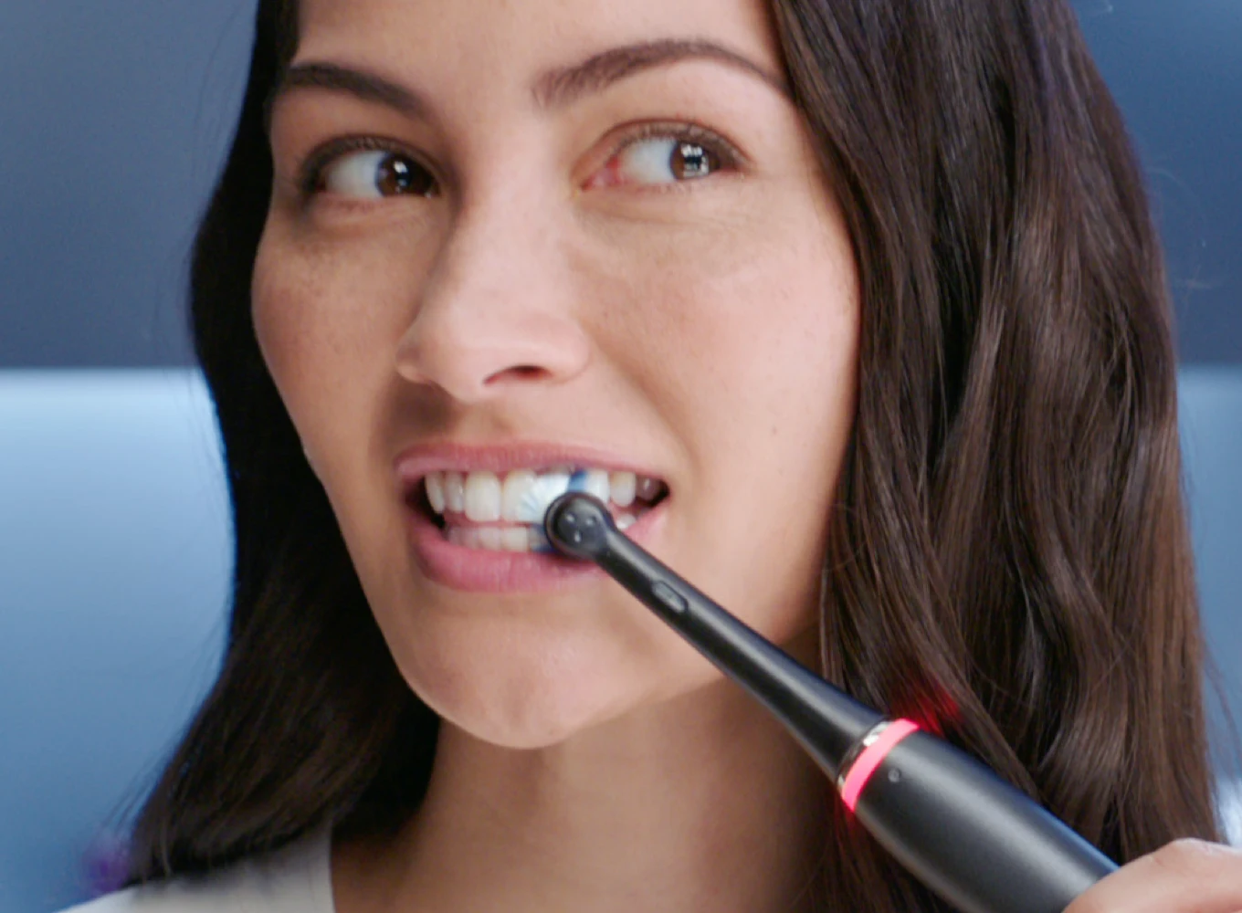 A girl brushing her teeth 