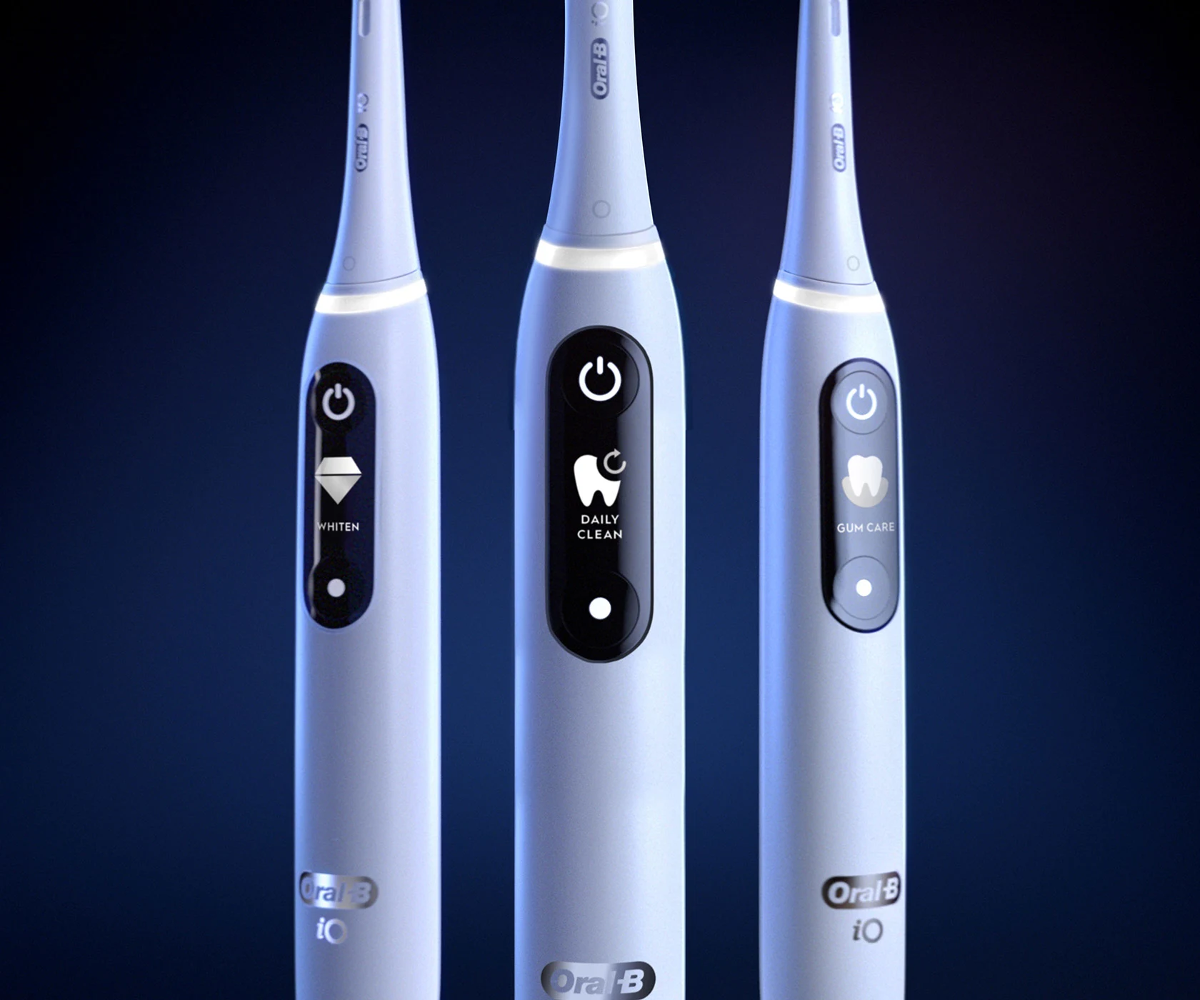 Trio of Oral-B iO Series 7 toothbrushes with different cleaning modes displayed 