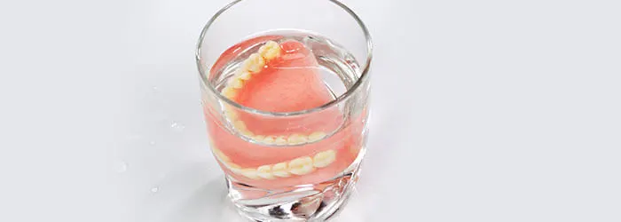 Dentures: Temporary & Permanent, Costs, Pros & Cons article banner