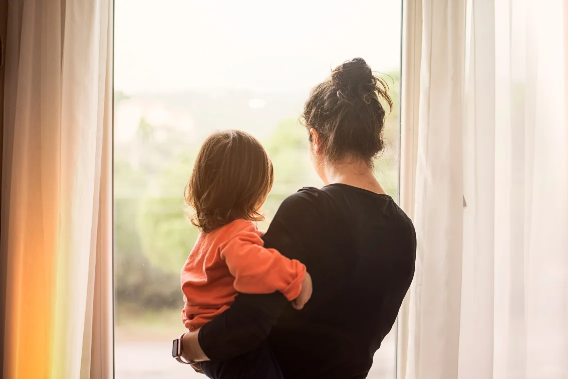 Sad woman holding child