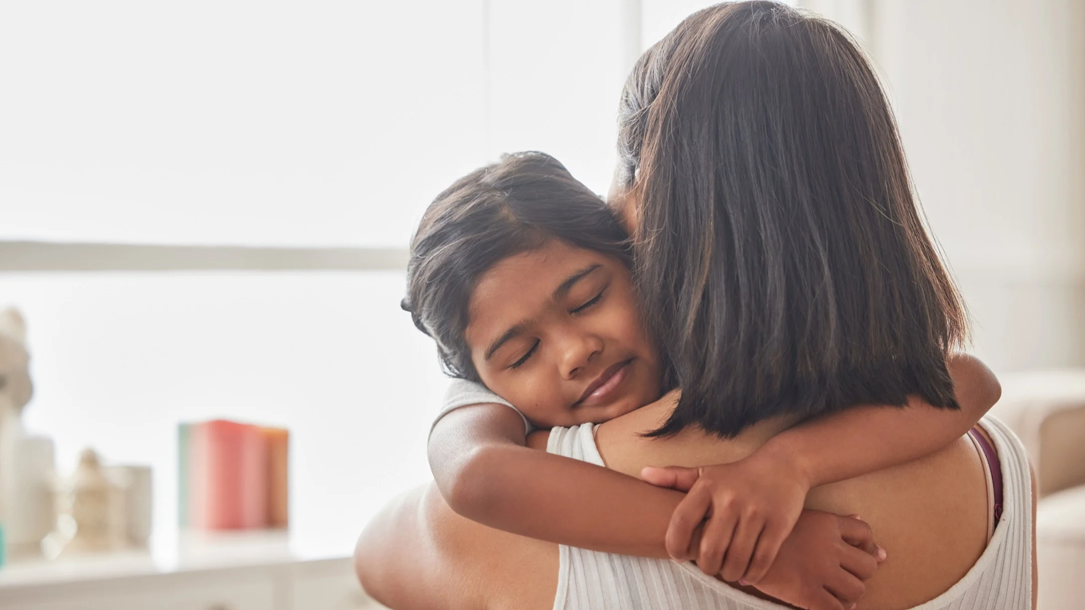 mom hugging child