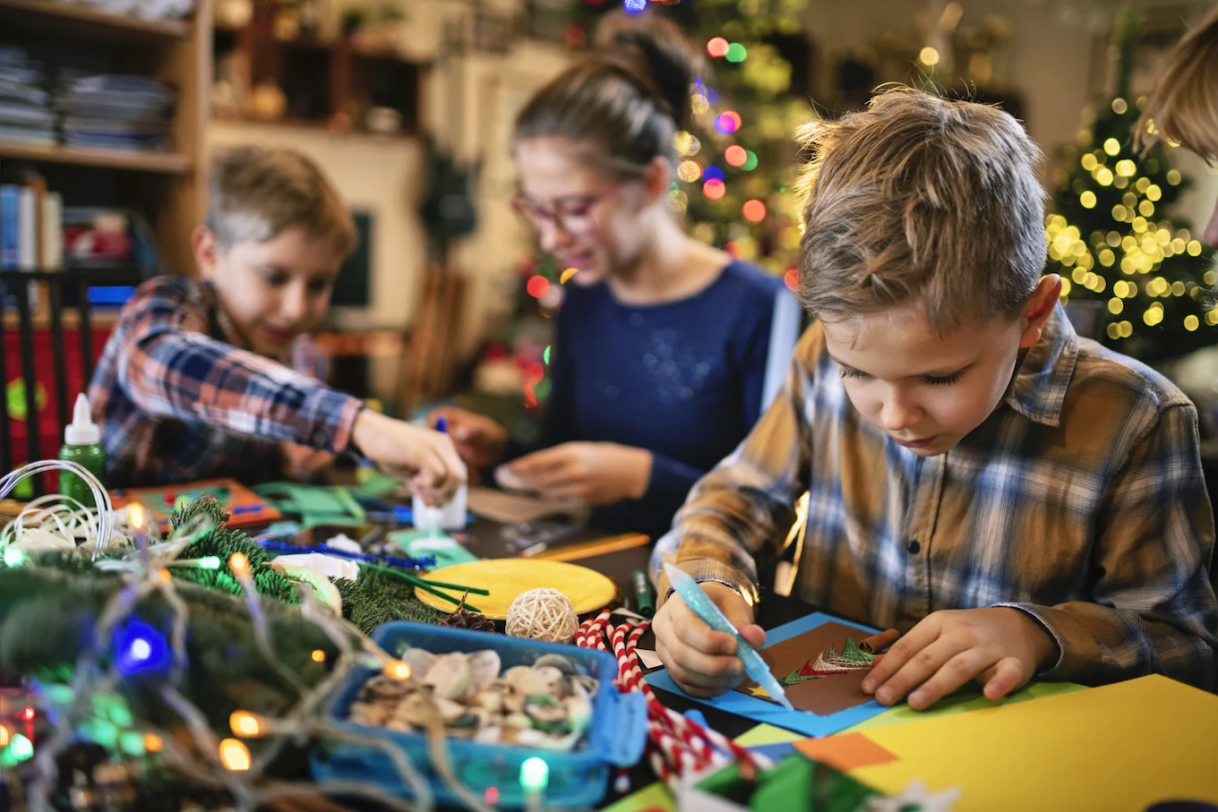 Family making holiday cards