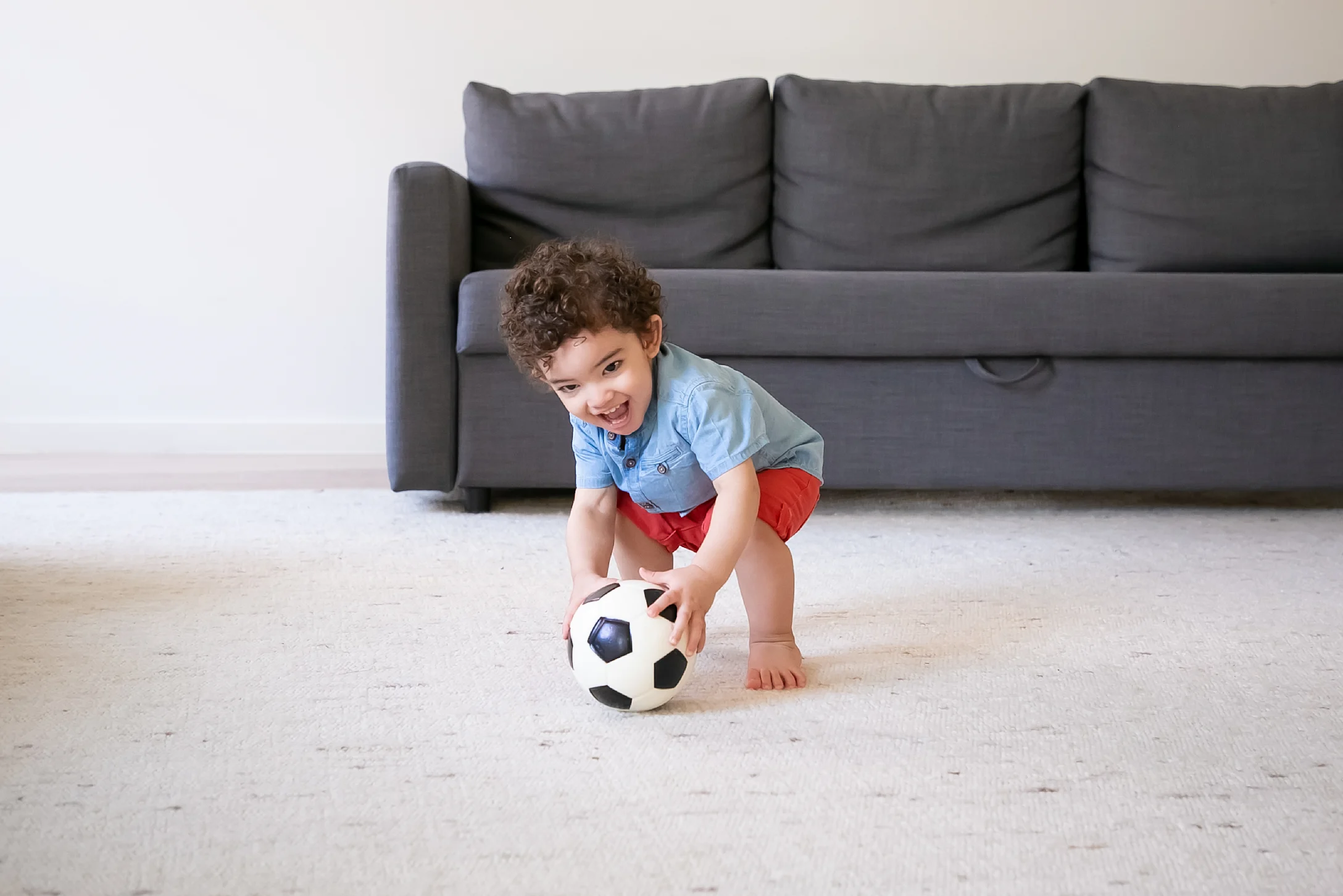 little boy playing soccer
