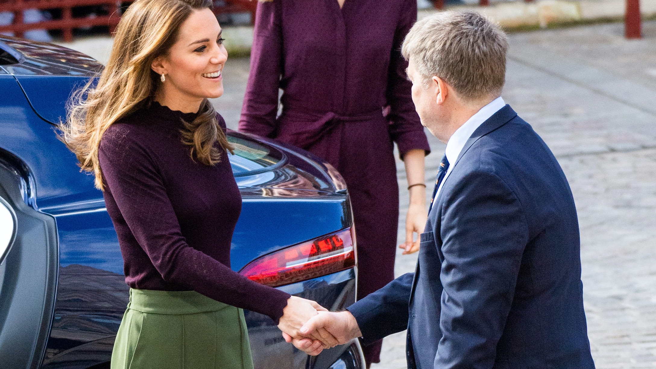 Kate Middleton Wears Blue Blouse and Cargo Pants for a Volunteer