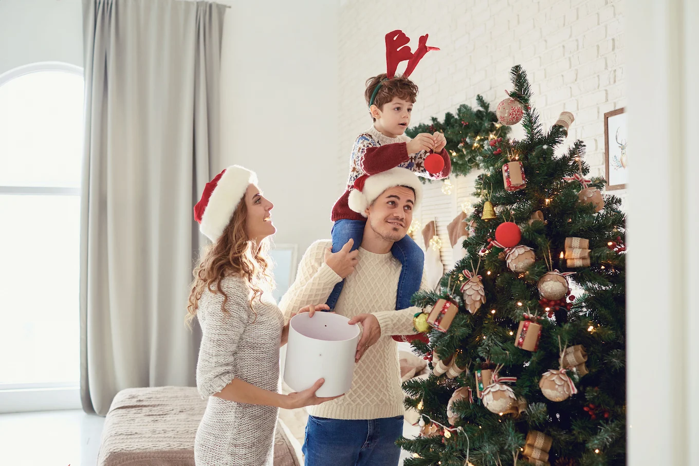 family decorating the christmas tree