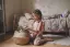 little girl putting toys in a basket-placeholder