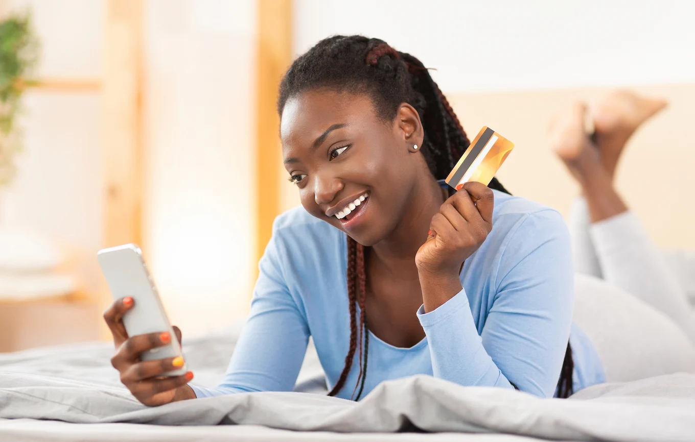 woman with credit card and phone