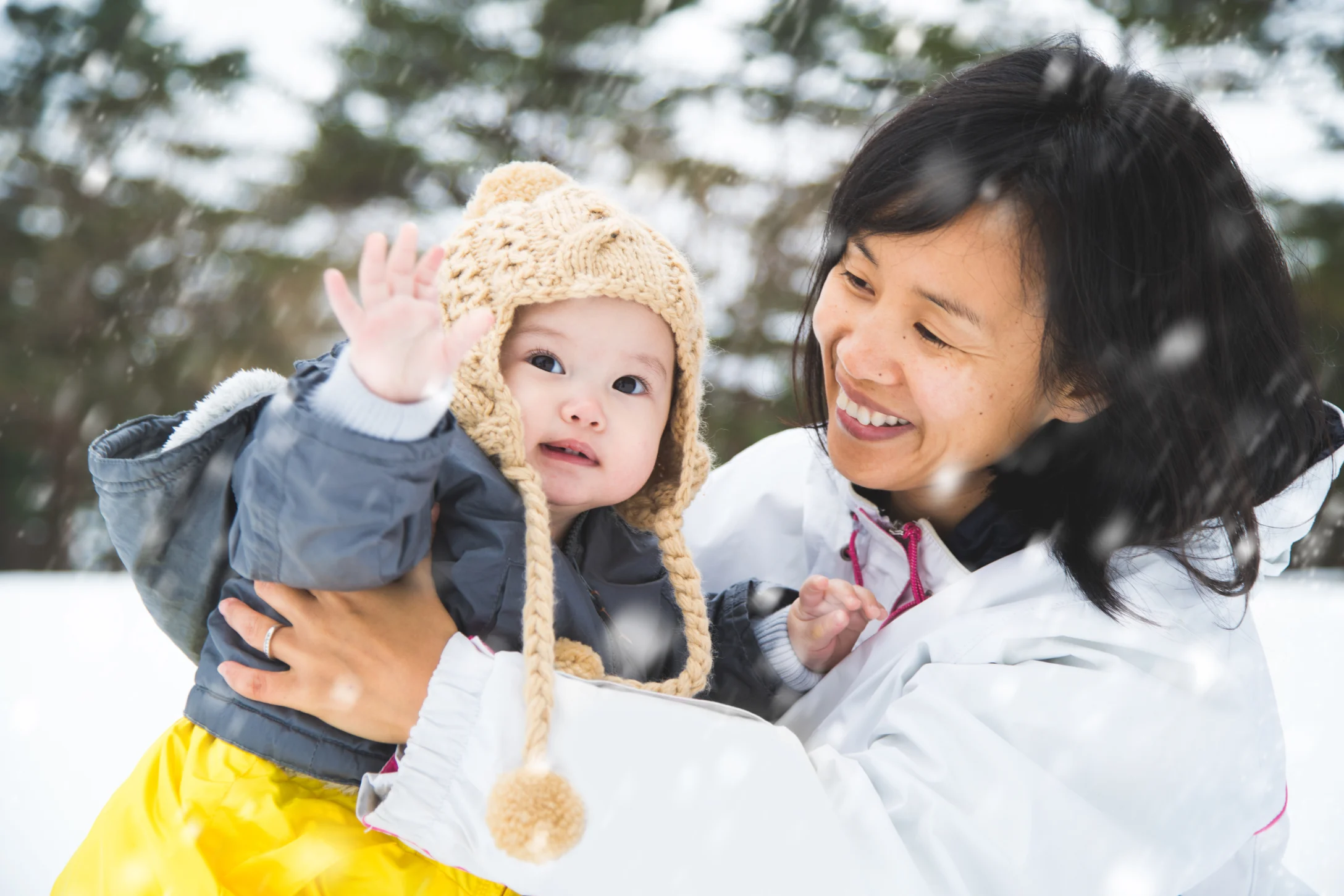 baby touching snow