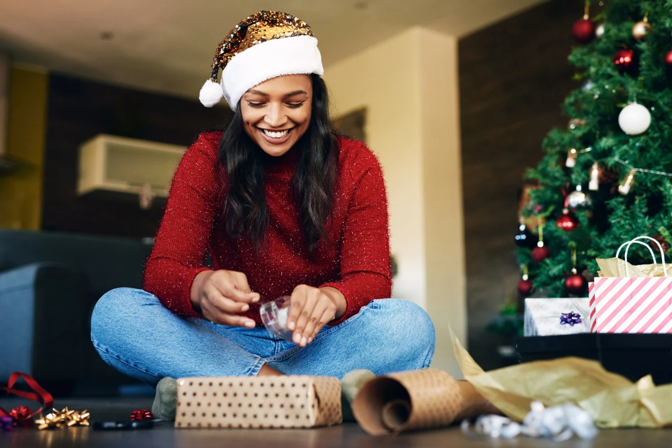 woman wrapping Christmas gifts