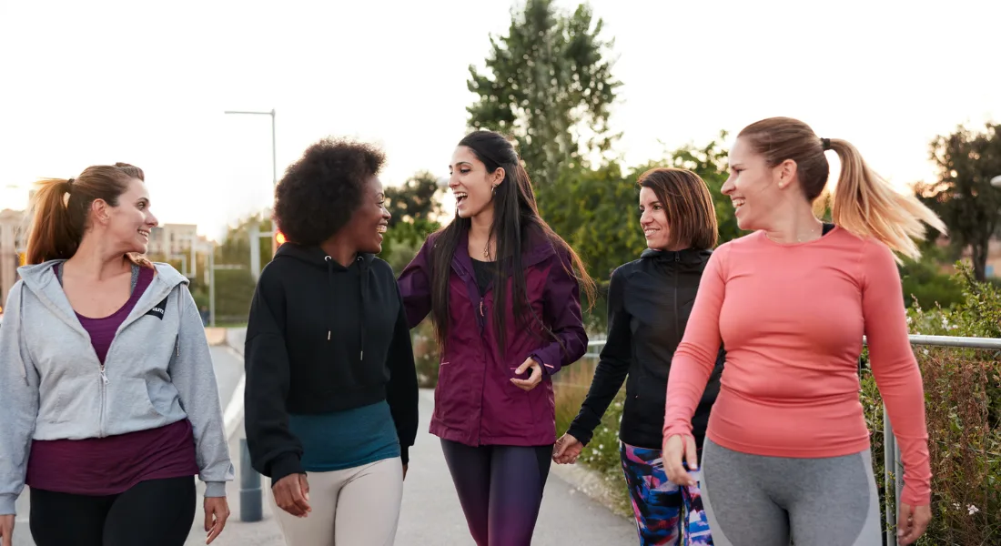 Women exercise in a group together