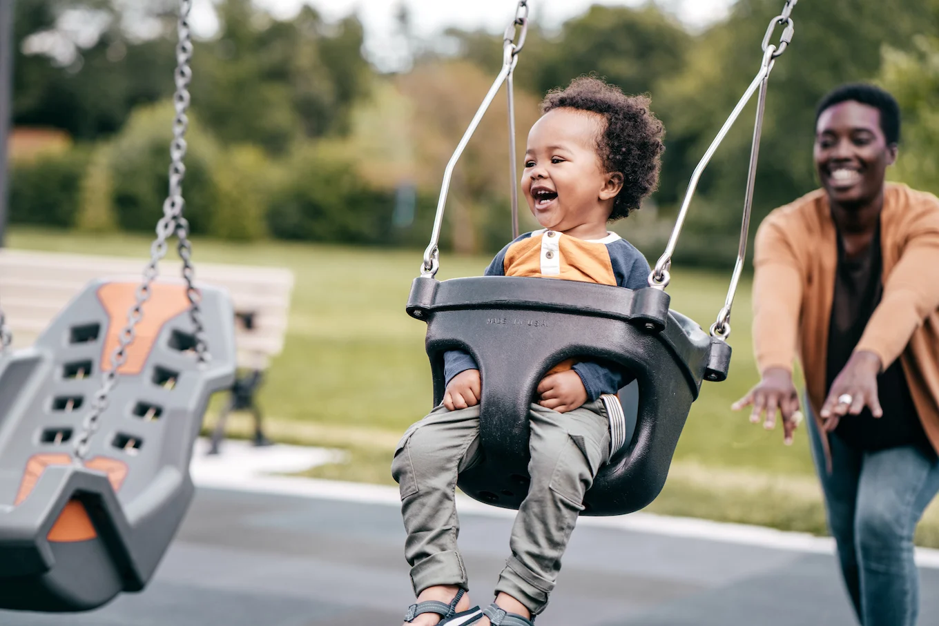 toddler swinging at park