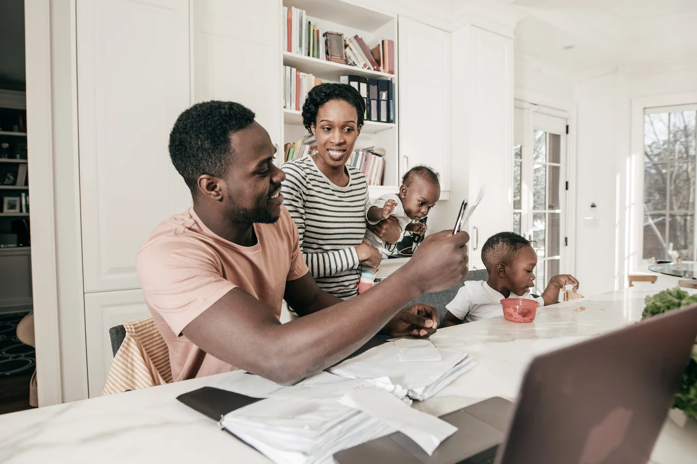 family at a table going over finances