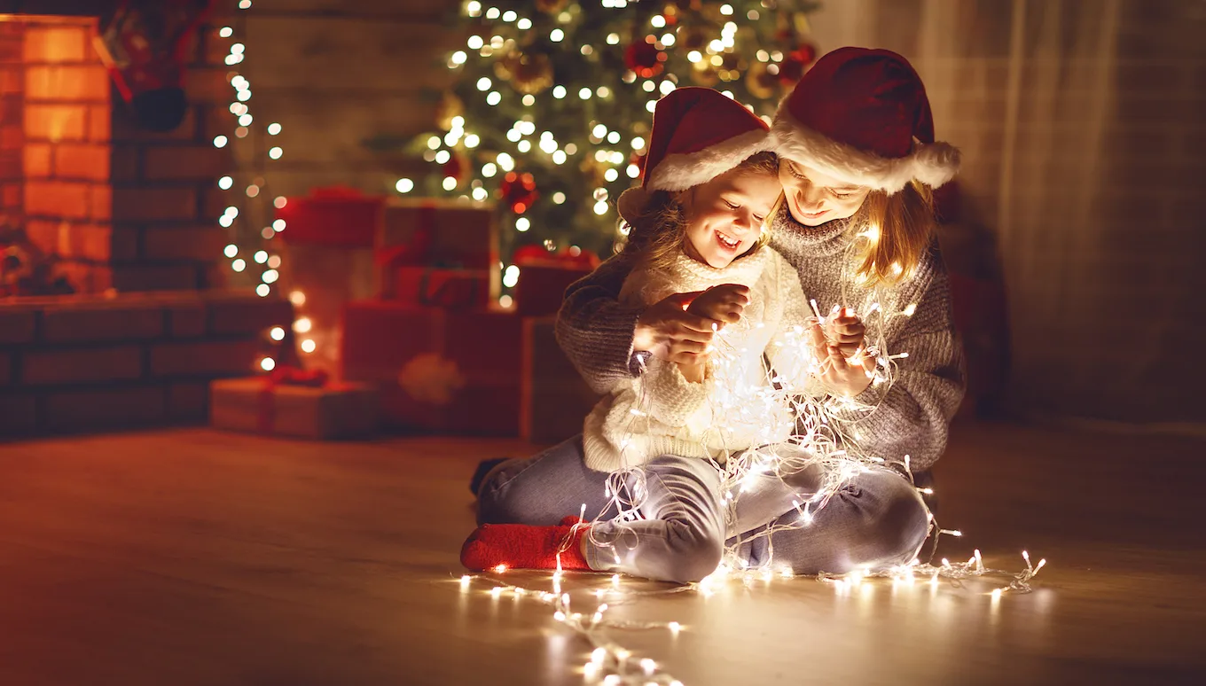 mom and daughter by tree