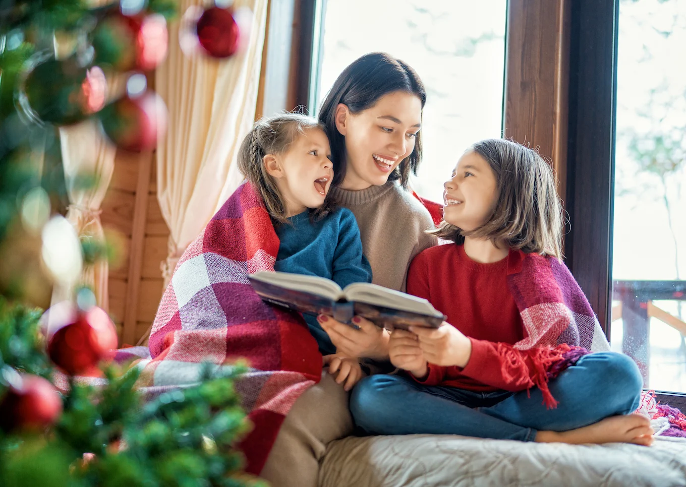 mom reading to her children at the holidays