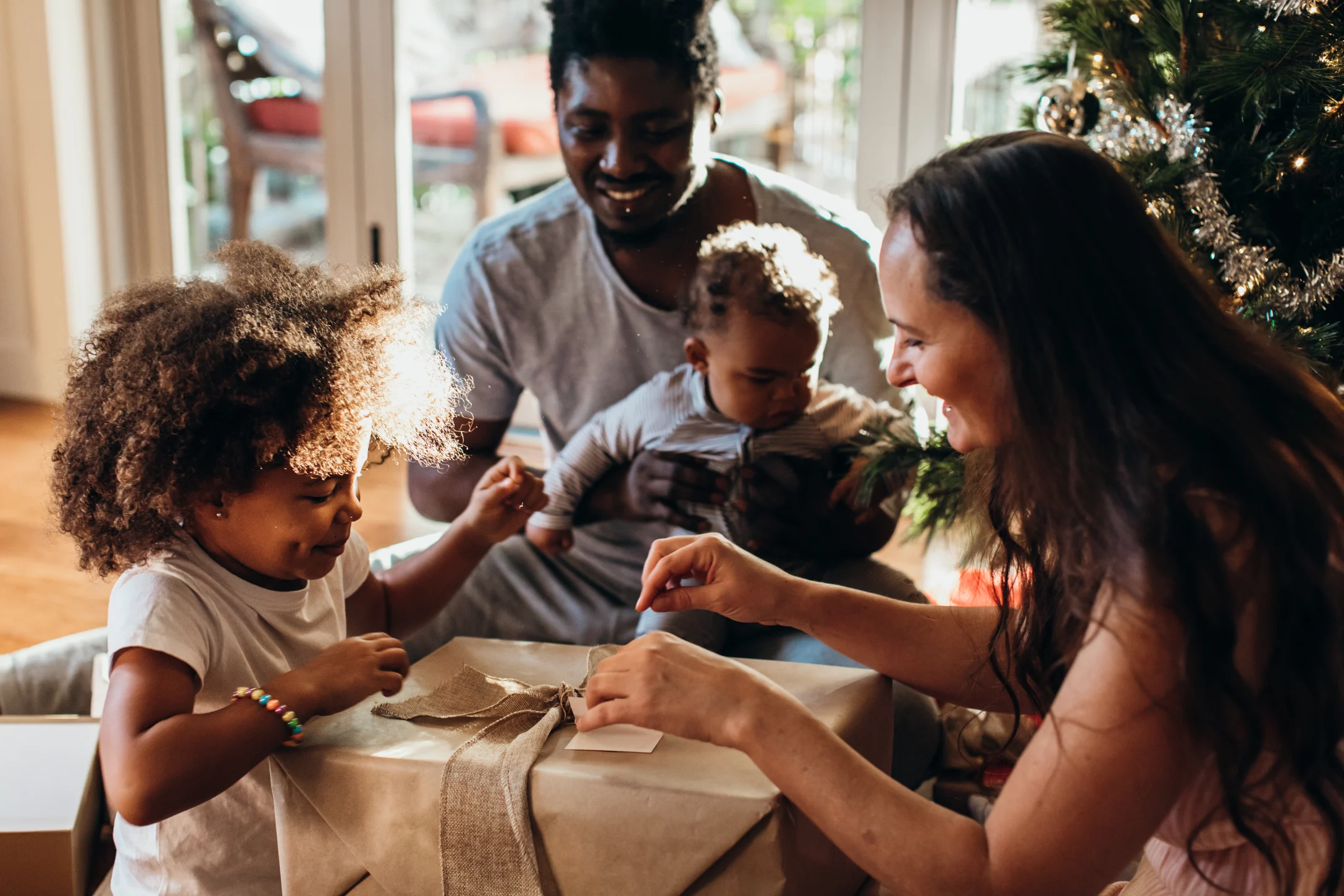 family opening Christmas gifts