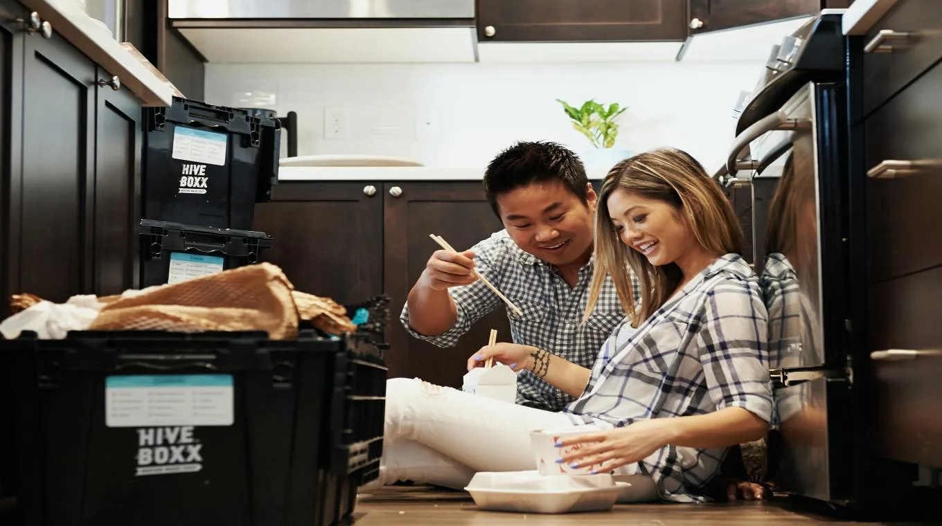 Asian couple eating takeout