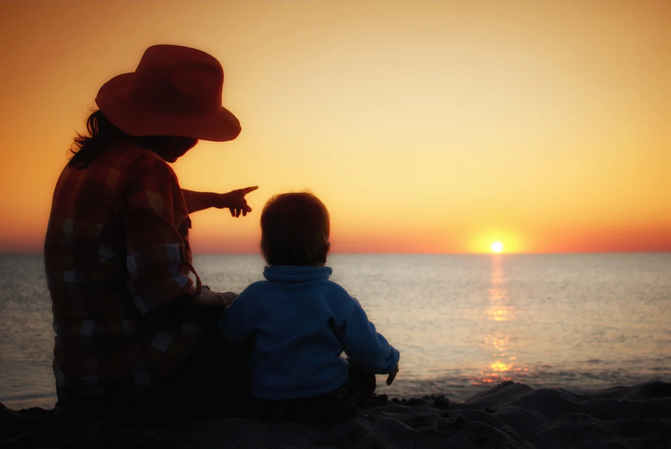 mom and son watching sun set