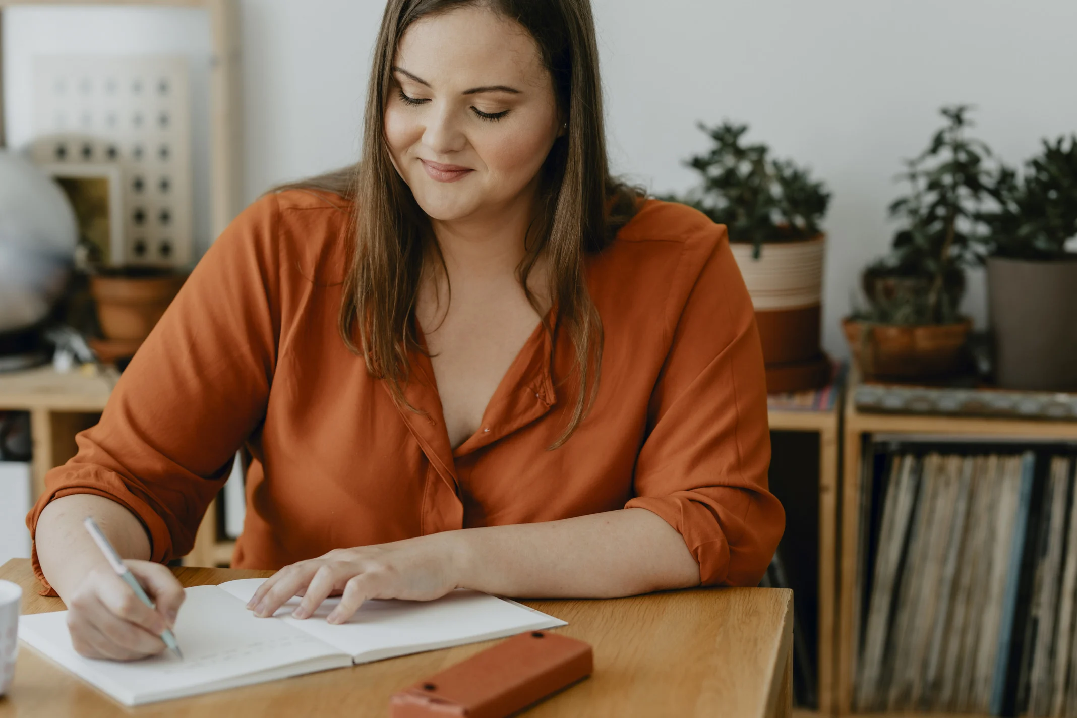 woman writing in a planner