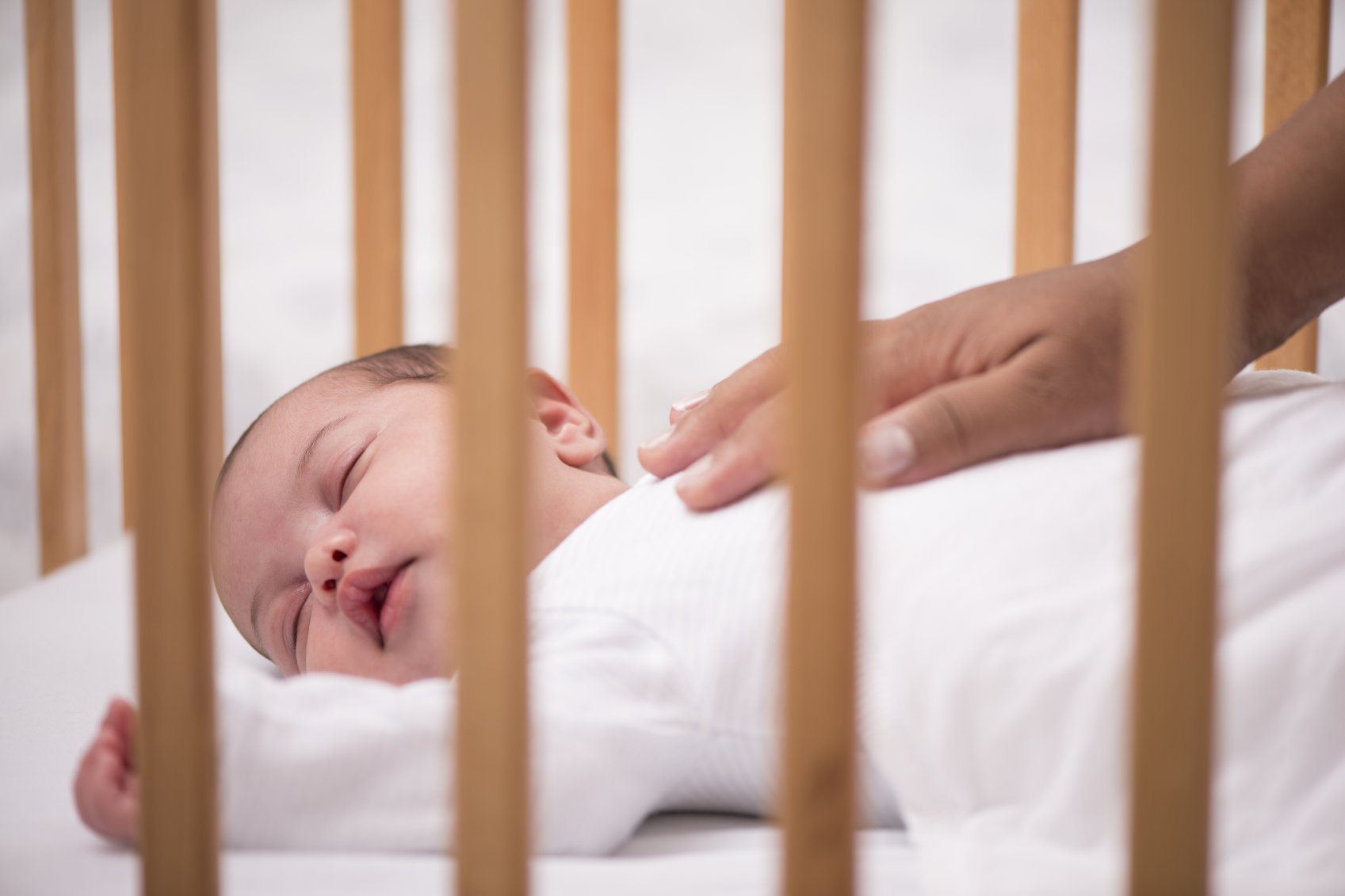 baby holding bed