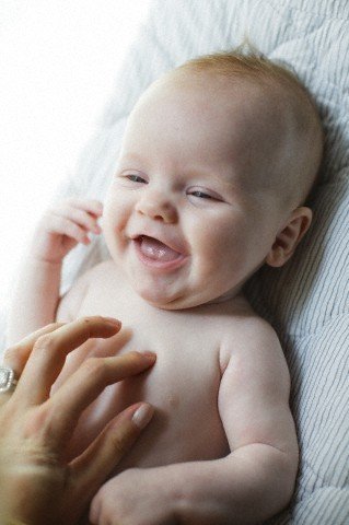 Baby laughing at cheap 2 months