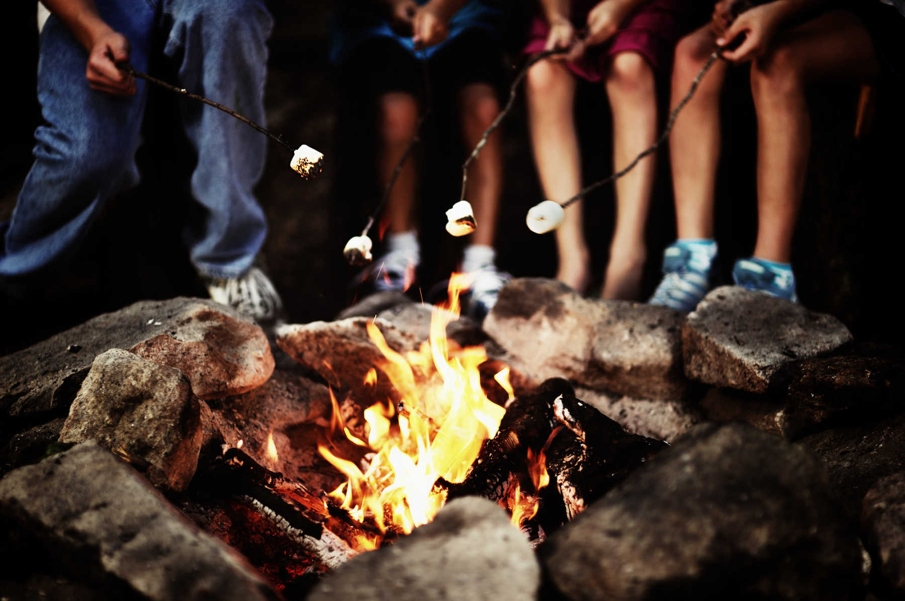 telling scary stories at the campfire (from